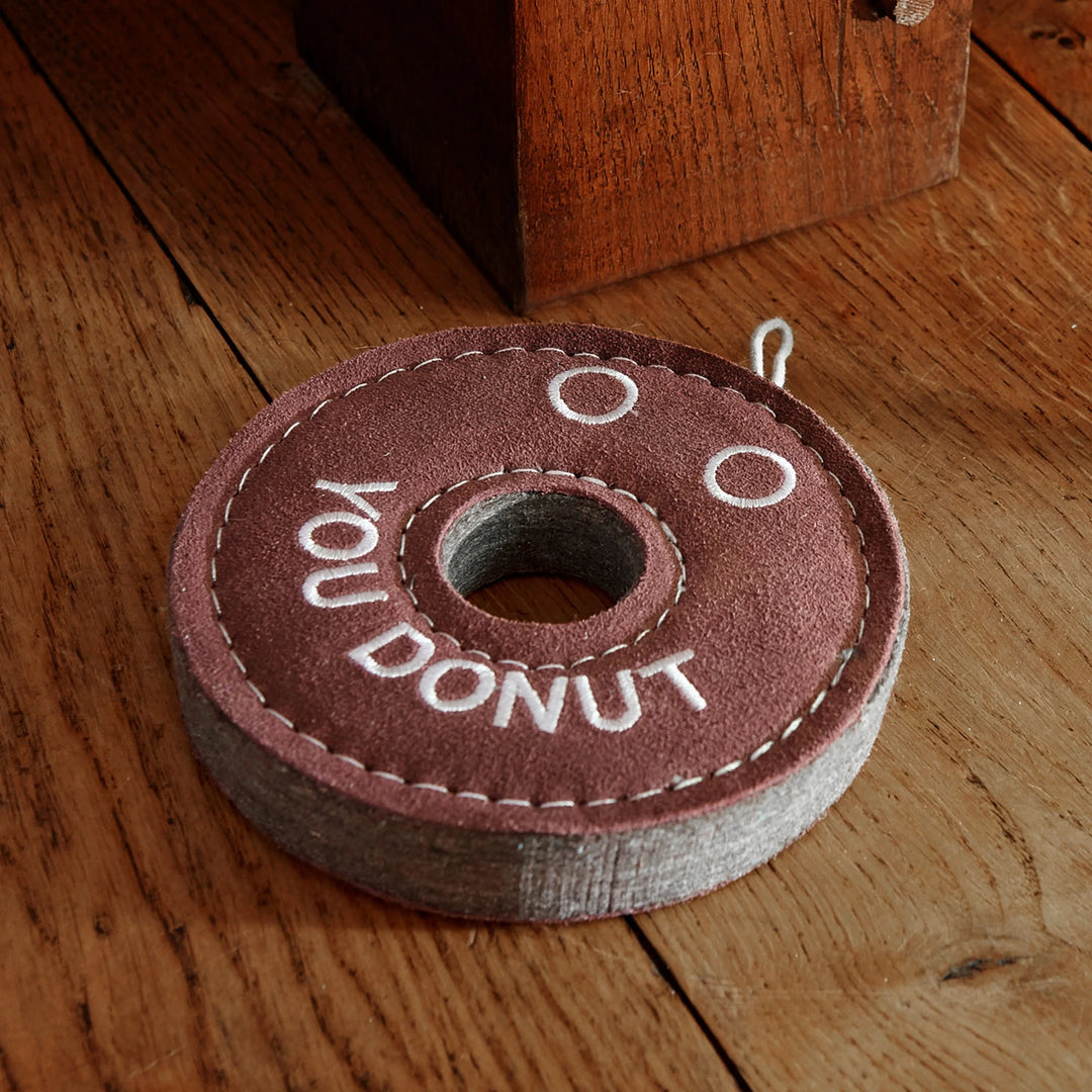 Eco friendly Derrick the Donut dog toy by Green and Wild’s suitable for medium sized and large sized dogs photographed indoors supplied by Paw Branch