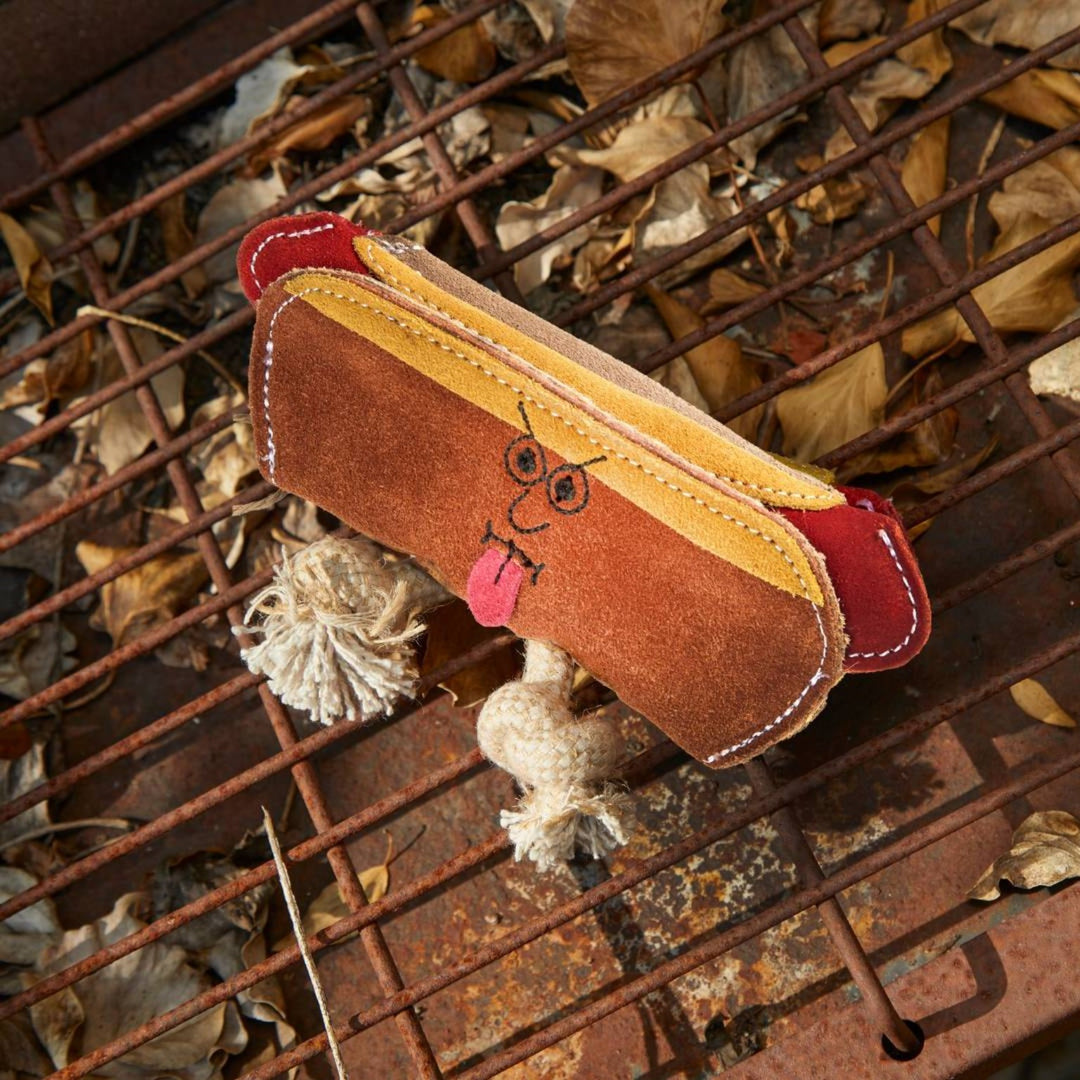 Eco friendly Harry the Hot Dog dog toy by Green and Wild’s suitable for small and medium sized dogs photographed outdoors supplied by Paw Branch