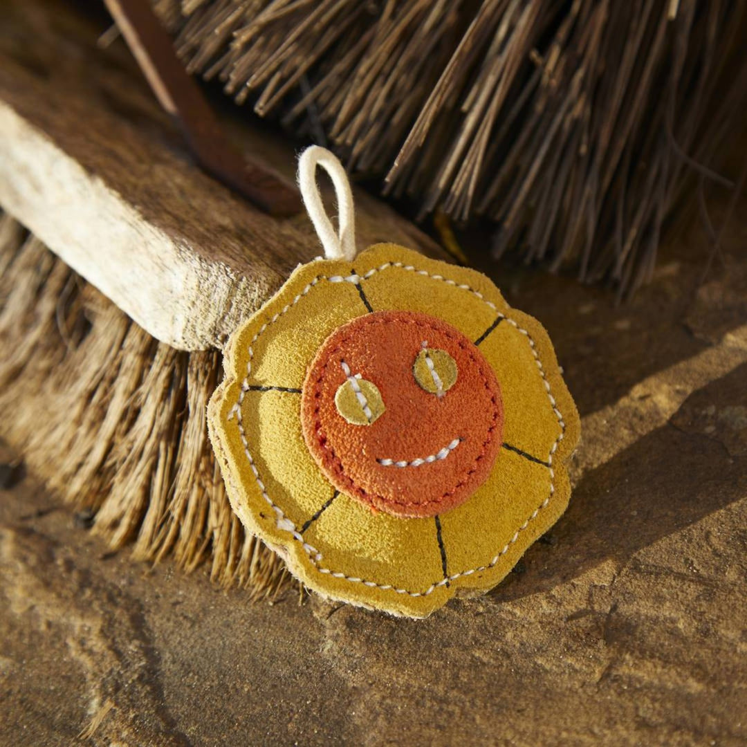 Eco friendly Sylvia the Sunflower dog toy by Green and Wild’s suitable for extra small sized dogs photographed outdoors supplied by Paw Branch