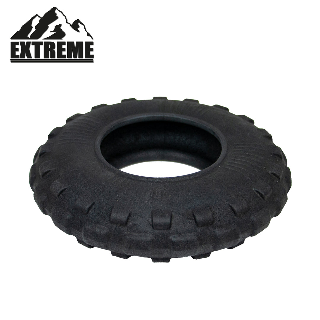 Studio shot of the black ANCOL Extreme Tyre toy, highlighting the rugged tread and durable rubber, supplied by Paw Branch.