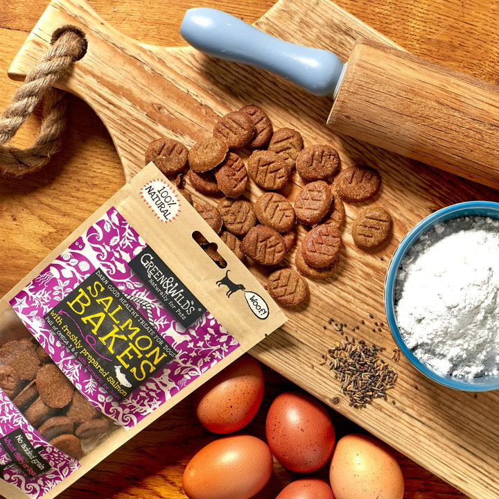Dog salmon bake treats on a wooden board with a package.