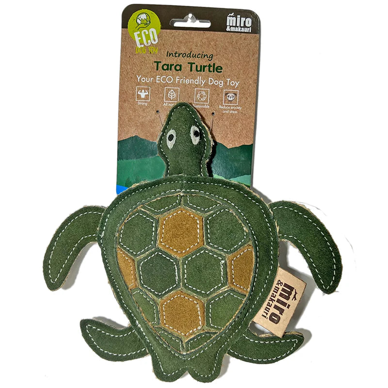 Studio shot of the green and brown leather Tara Turtle toy, highlighting the natural stitching, supplied by Paw Branch.
